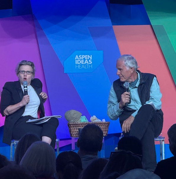 Kate McKinnon and Dr. Timothy Ladwig speaking on stage at Aspen Ideas Health